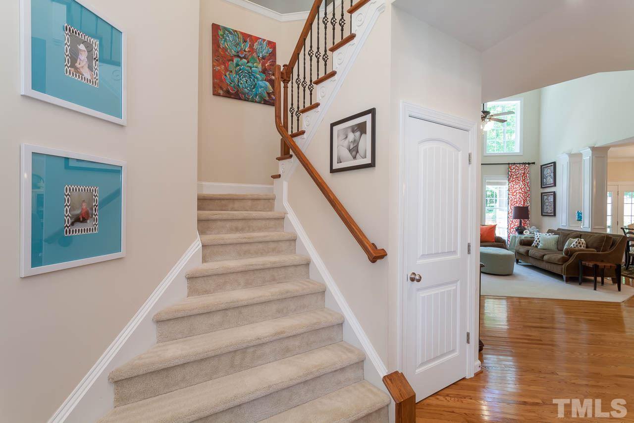 1014 Vino Drive Raleigh, NC 27607 - Photo 8 of 25 a view of entryway and hall with wooden floor