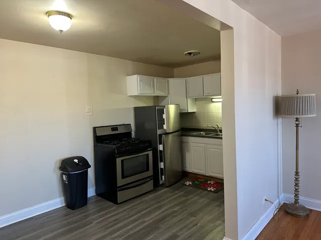 a kitchen with a stove and a refrigerator