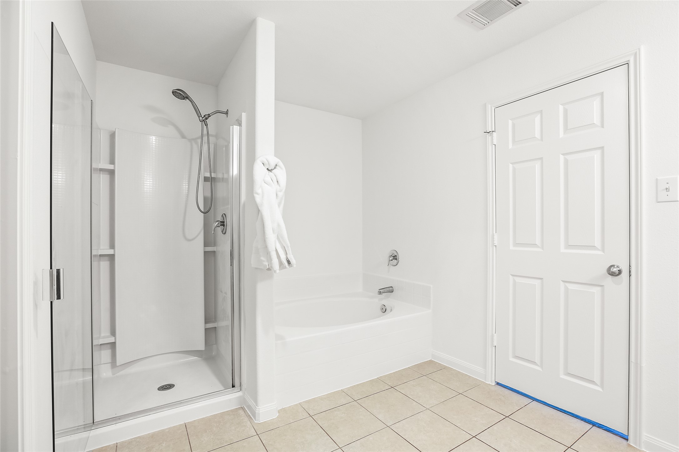 100 Robertson Lane Jarrell, TX 76537 - Photo 14 of 29 Primary bathroom with separate shower and garden tub