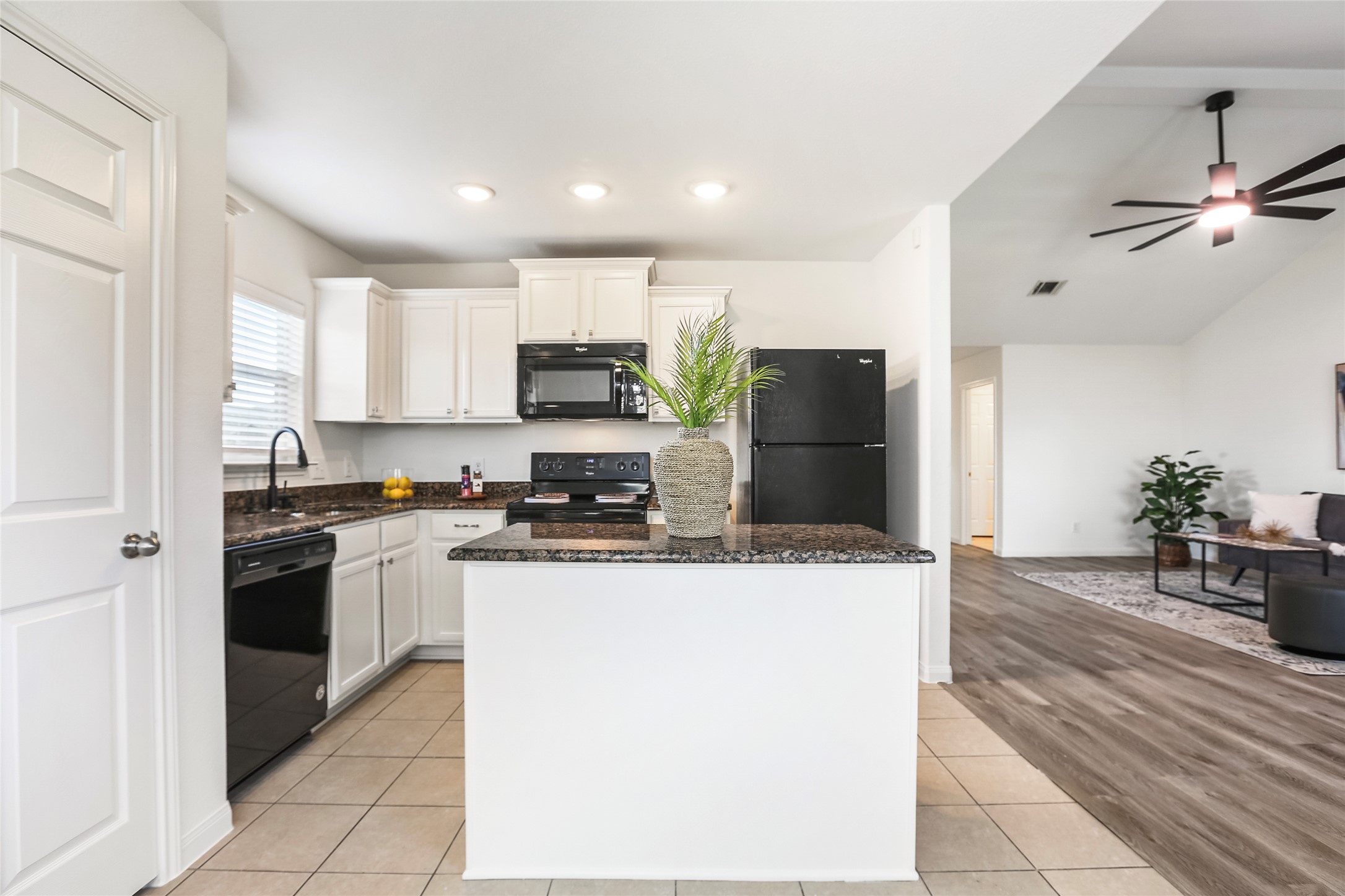 100 Robertson Lane Jarrell, TX 76537 - Photo 7 of 29 Open kitchen with recessed lighting and granite counters