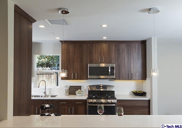 3675 Newhaven Road Pasadena, CA 91107 - Photo 14 of 39 a kitchen with a sink a window stainless steel appliances and cabinets
