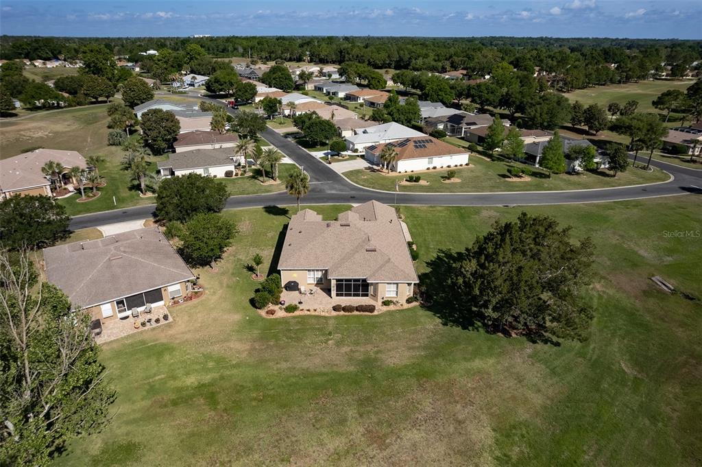 15525 Southwest 14th Avenue Road Ocala, FL 34473 - Photo 69 of 75 an aerial view of residential houses with outdoor space and trees