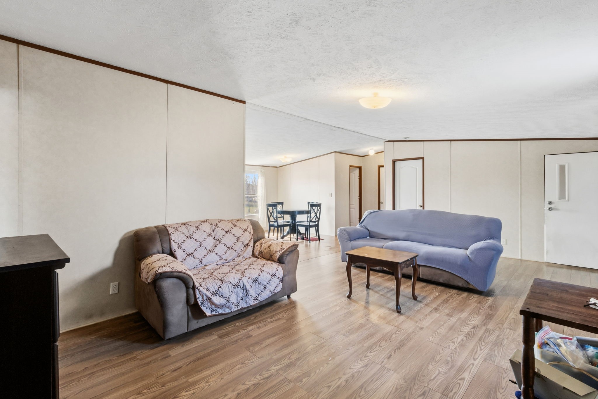 3412 Huffman-Eastgate Road Huffman, TX 77336 - Photo 13 of 43 a living room with furniture and a wooden floor