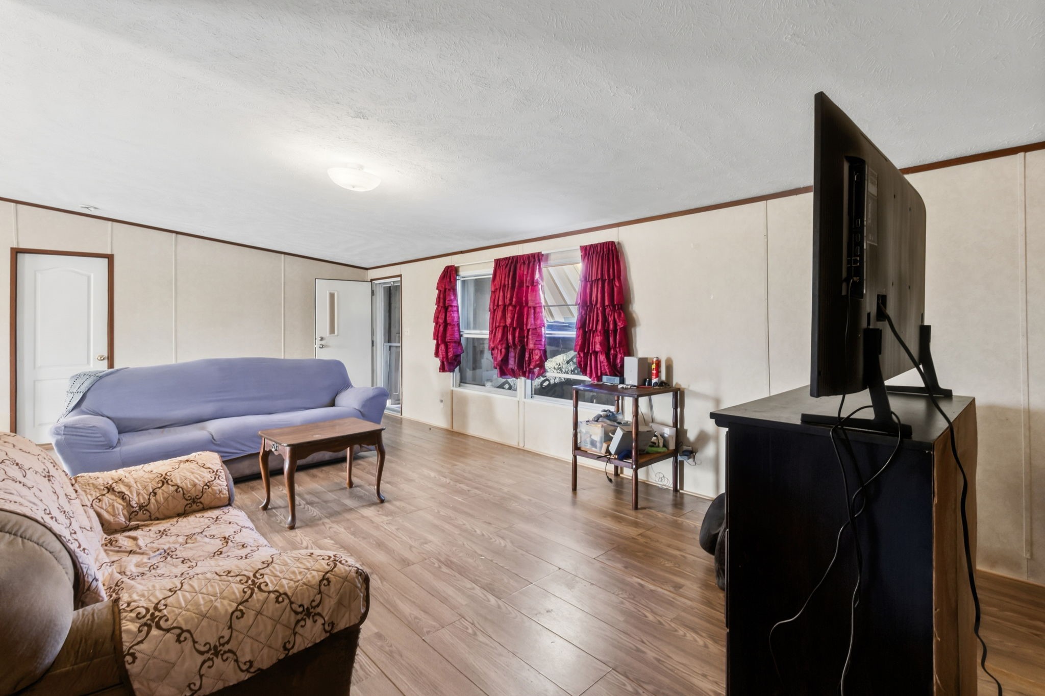 3412 Huffman-Eastgate Road Huffman, TX 77336 - Photo 16 of 43 a living room with furniture and a wooden floor