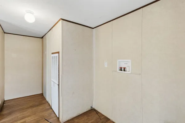 a bedroom with a bed and a closet