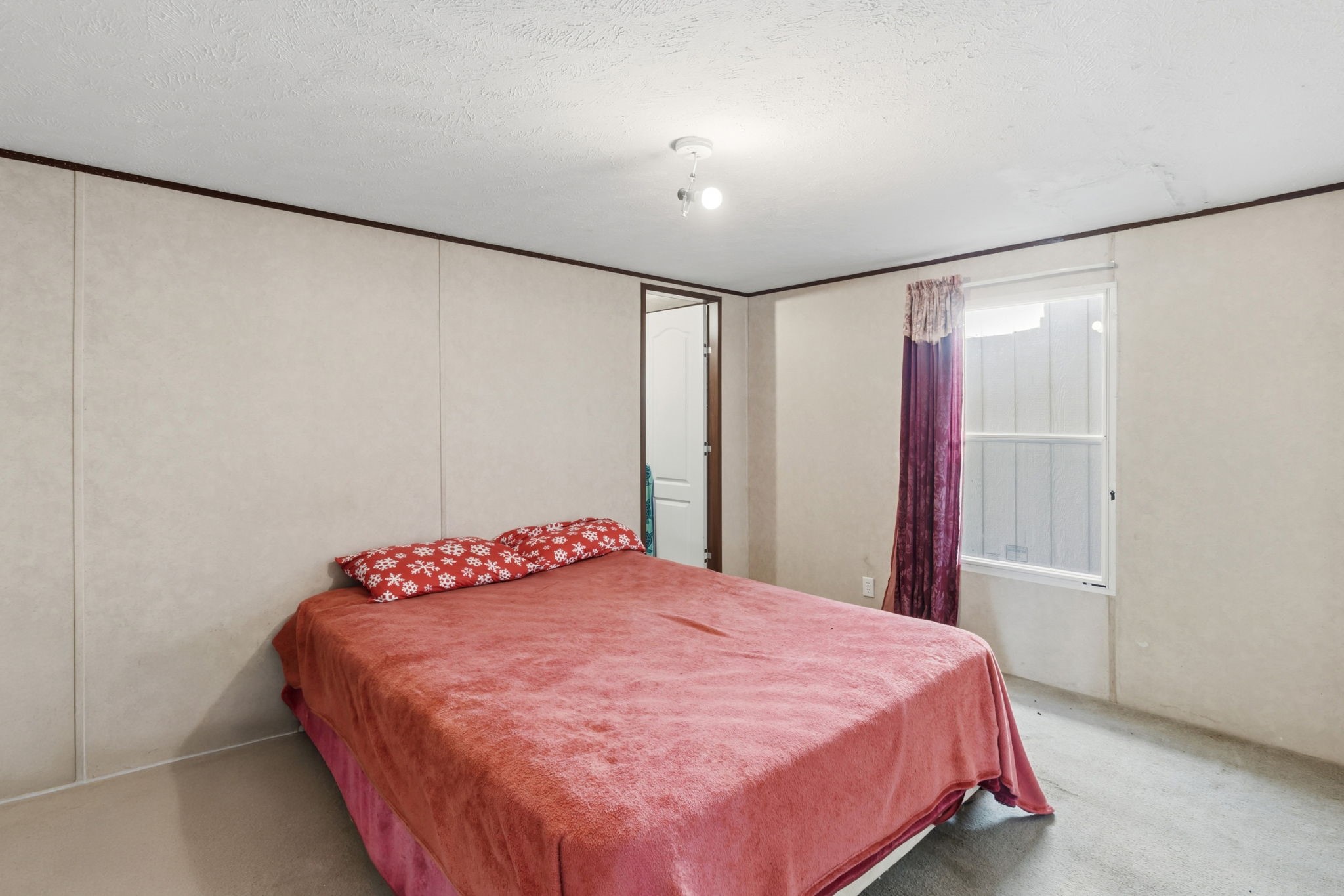 3412 Huffman-Eastgate Road Huffman, TX 77336 - Photo 27 of 43 a bedroom with a bed and a closet