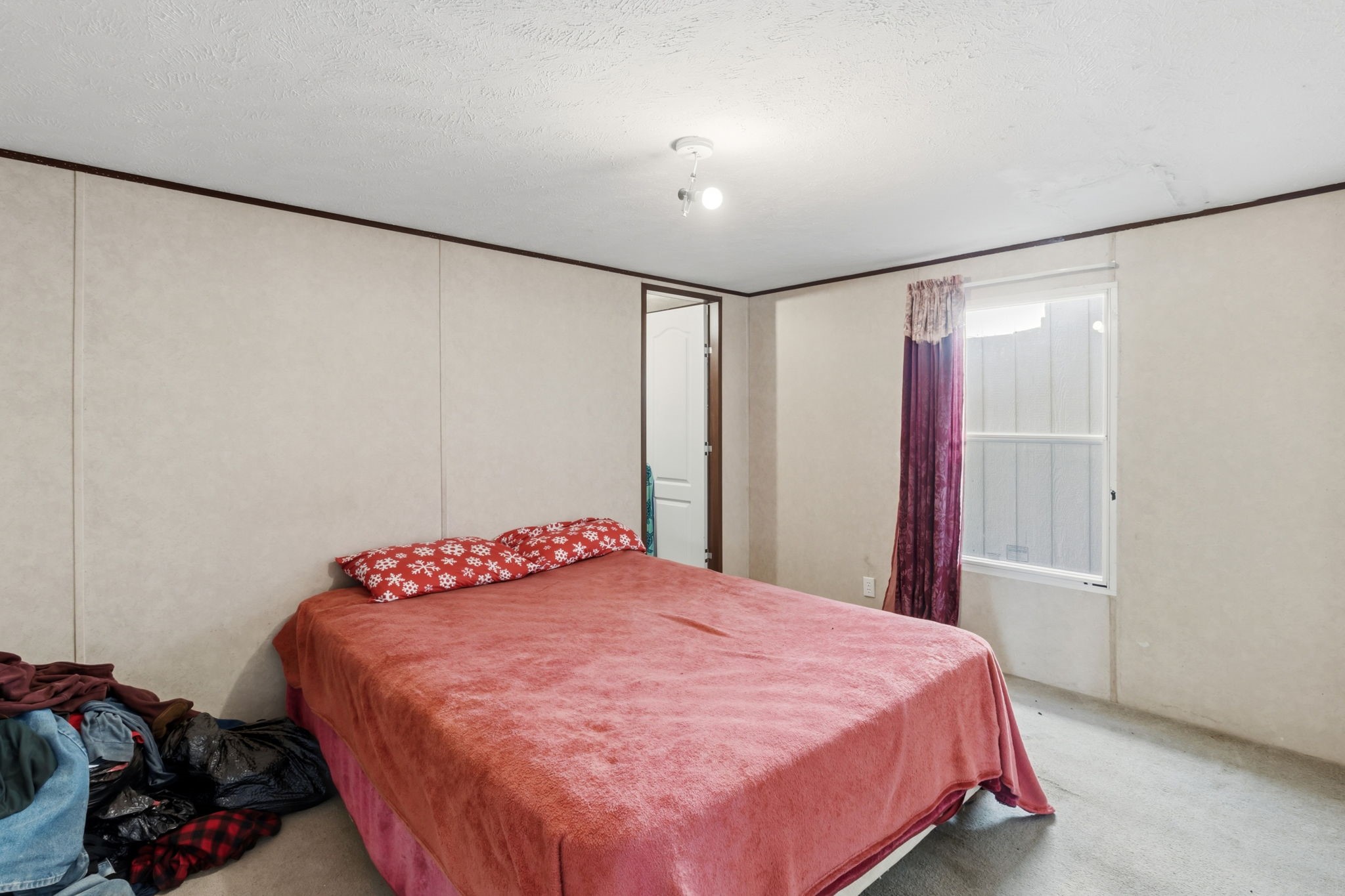 3412 Huffman-Eastgate Road Huffman, TX 77336 - Photo 28 of 43 a bedroom with a bed and a closet