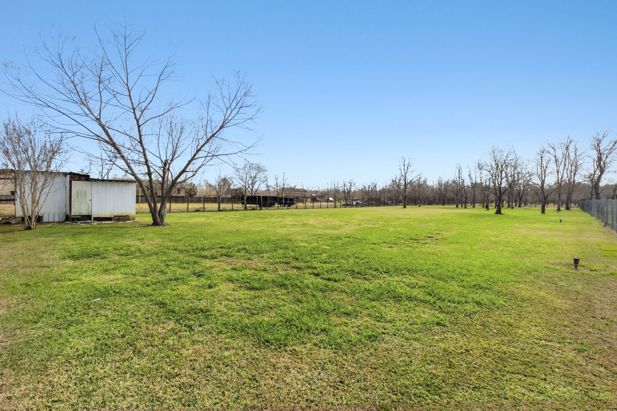 3412 Huffman-Eastgate Road Huffman, TX 77336 - Photo 31 of 43 a view of yard with tree and a wooden fence