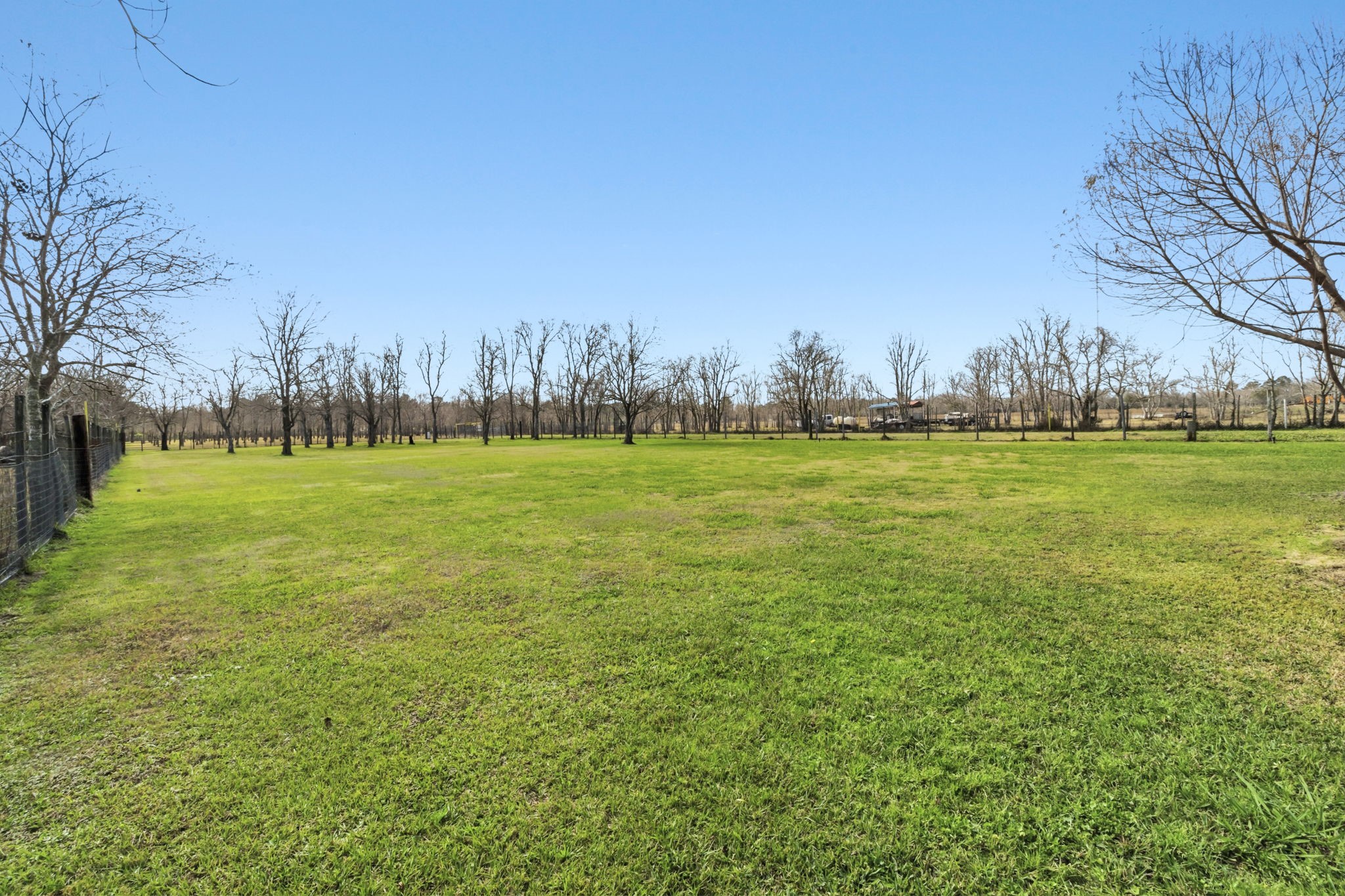 3412 Huffman-Eastgate Road Huffman, TX 77336 - Photo 34 of 43 a view of a field with an trees in the background