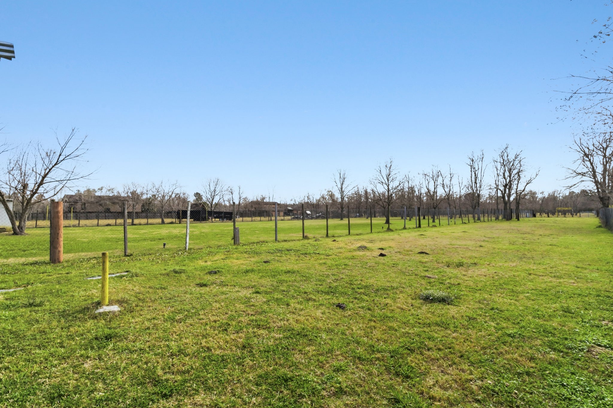 3412 Huffman-Eastgate Road Huffman, TX 77336 - Photo 35 of 43 a view of a field with a tree in a yard