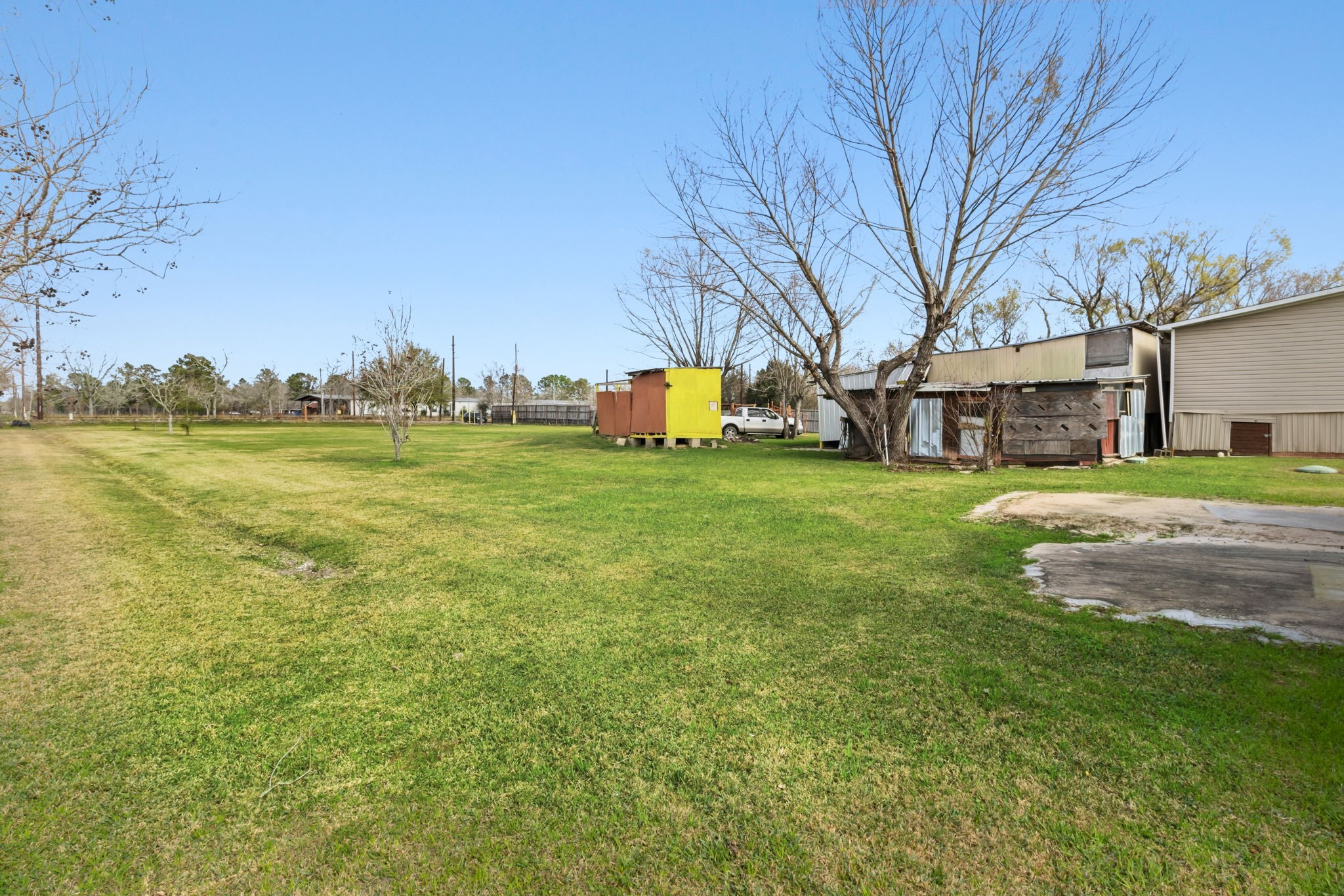 3412 Huffman-Eastgate Road Huffman, TX 77336 - Photo 8 of 43 a view of a field of grass and trees