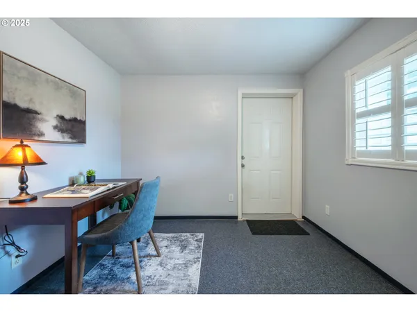 a workspace with furniture and window