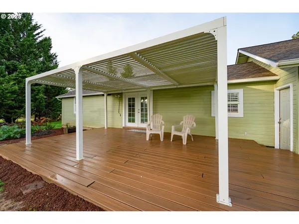 a view of a patio with wooden floor