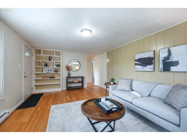a living room with furniture and a rug