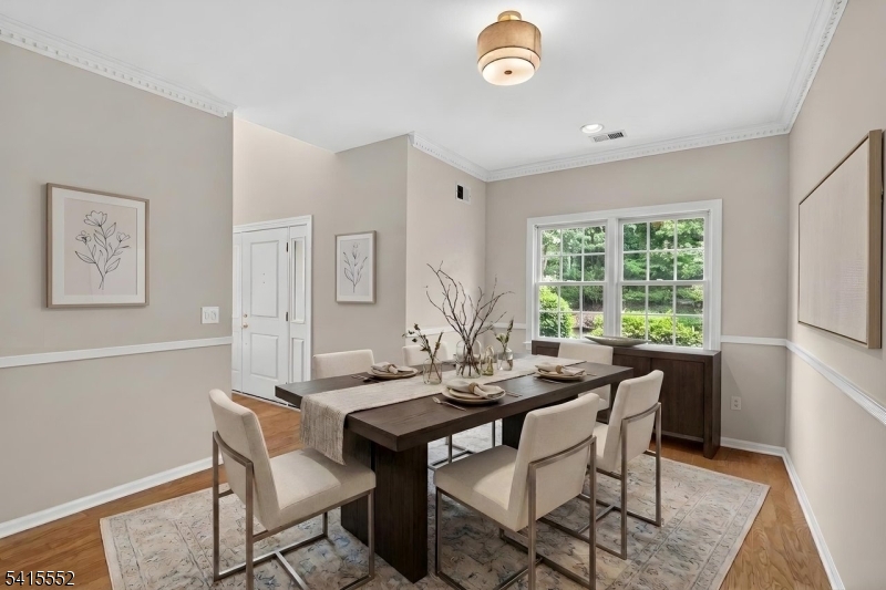 33 Four Oaks Road Bedminster, NJ 07921 - Photo 15 of 29 a view of a dining room with furniture window and wooden floor