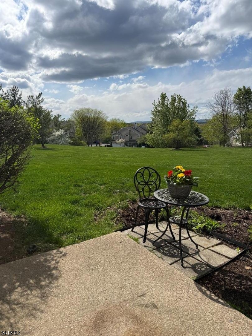 33 Four Oaks Road Bedminster, NJ 07921 - Photo 29 of 29 a view of a bench in the garden near a lake
