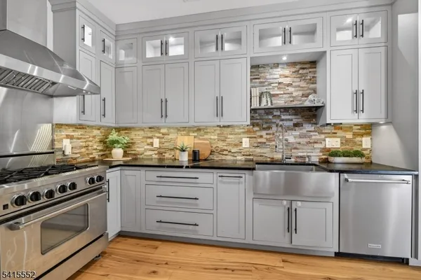 a kitchen with sink cabinets and window