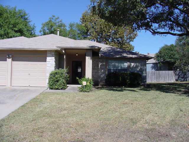 12610 Andromeda Cove Austin, TX 78727 - Photo 1 of 1 a front view of a house with garden