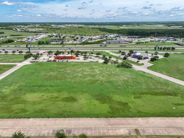 a view of a golf course with a building