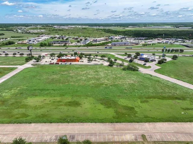 a view of a golf course with a building