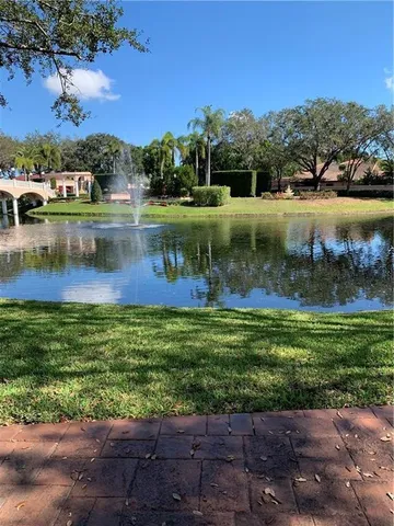 a view of a lake with houses in the back
