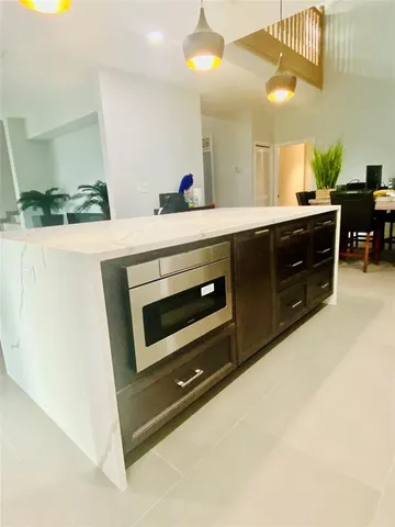 a bathroom with a sink a vanity and a mirror