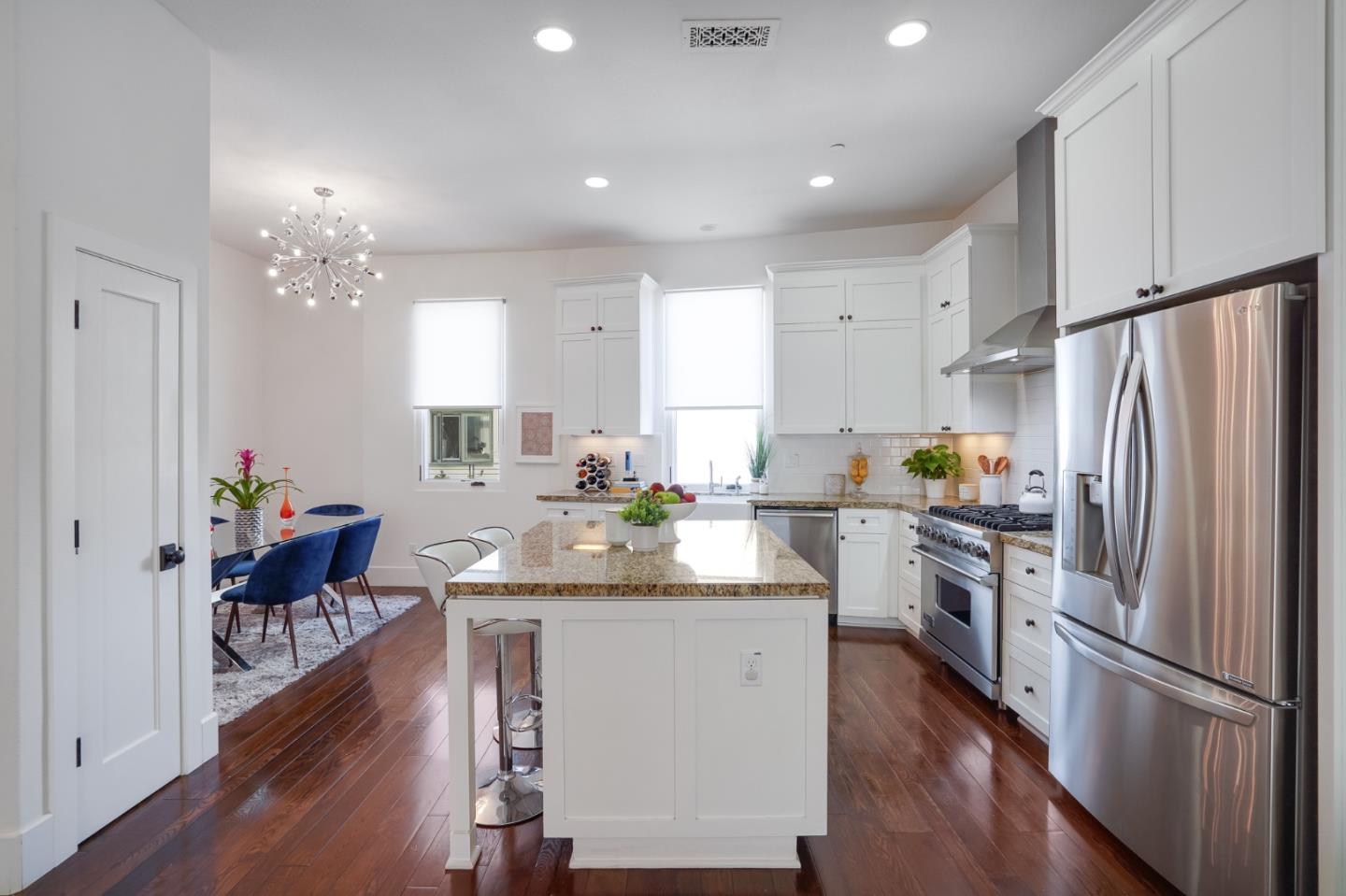 536 Fierro Loop Campbell, CA 95008 - Photo 18 of 57 a kitchen with granite countertop a sink appliances refrigerator and wooden floor