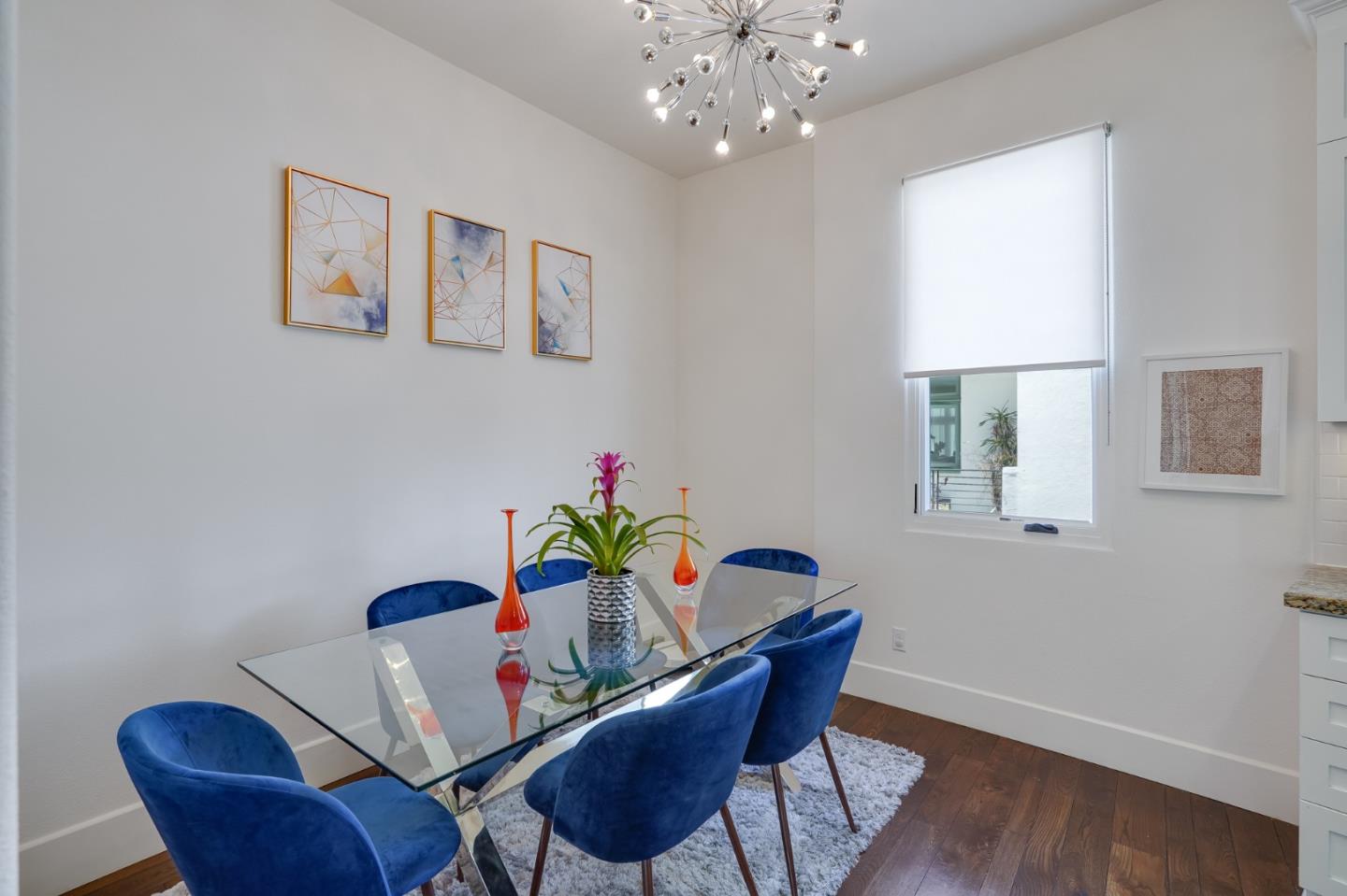 536 Fierro Loop Campbell, CA 95008 - Photo 21 of 57 a dining room with furniture potted plants and wooden floor
