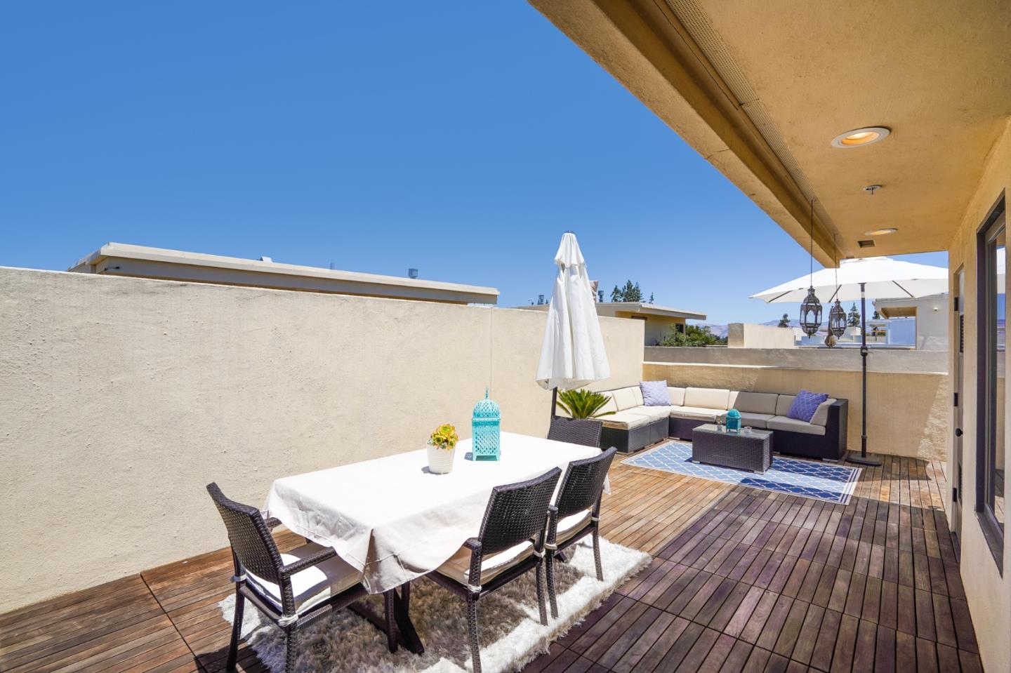 536 Fierro Loop Campbell, CA 95008 - Photo 41 of 57 a view of a patio with table and chairs and potted plants
