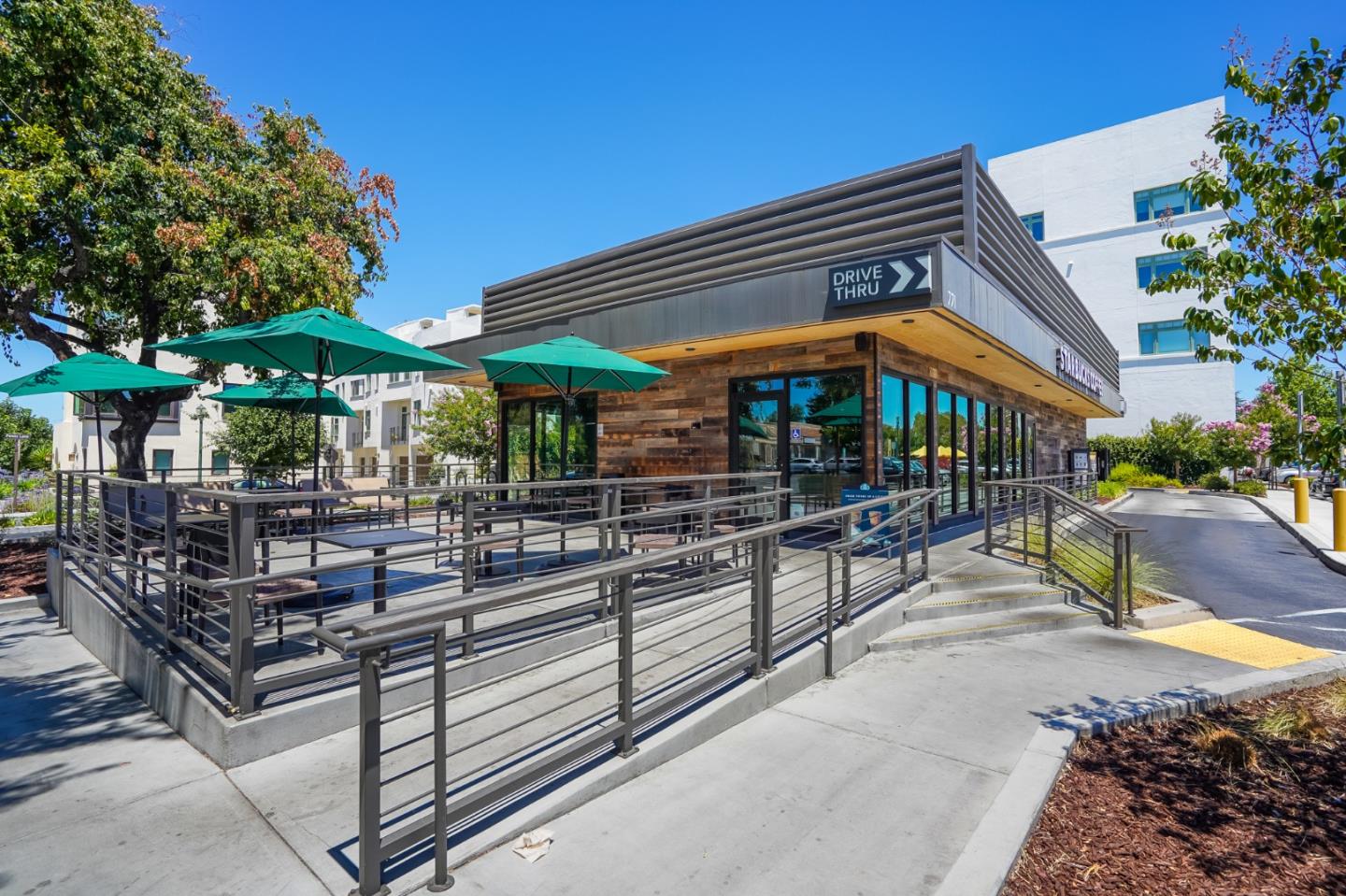 536 Fierro Loop Campbell, CA 95008 - Photo 54 of 57 a view of the patio with a table and chairs under an umbrella
