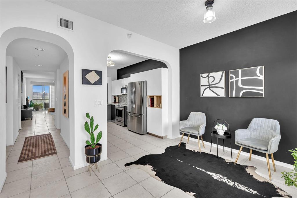 7775 Southampton Terrace, Unit 405 Tamarac, FL 33321 - Photo 14 of 82 a living room with furniture and a rug
