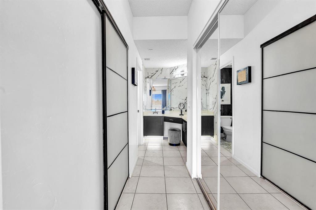 7775 Southampton Terrace, Unit 405 Tamarac, FL 33321 - Photo 30 of 82 a kitchen with stainless steel appliances a refrigerator and a stove top oven