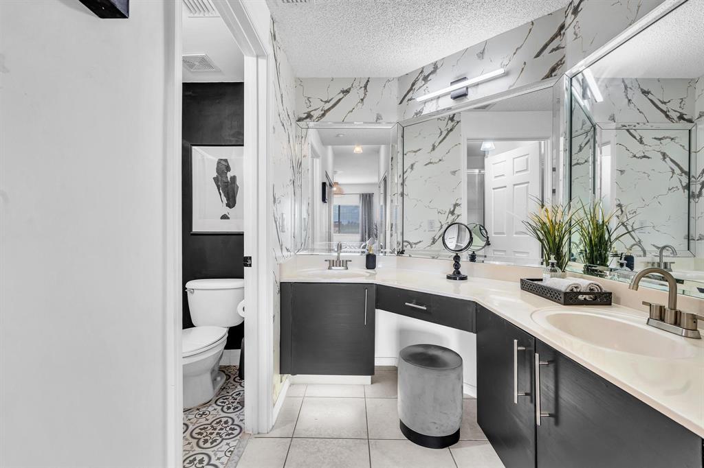 7775 Southampton Terrace, Unit 405 Tamarac, FL 33321 - Photo 31 of 82 a spacious bathroom with a sink and a mirror