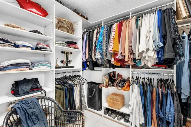 a view of a balcony with a floor to ceiling window and wooden fence