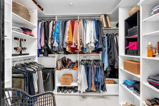 a view of a chair and table in the balcony