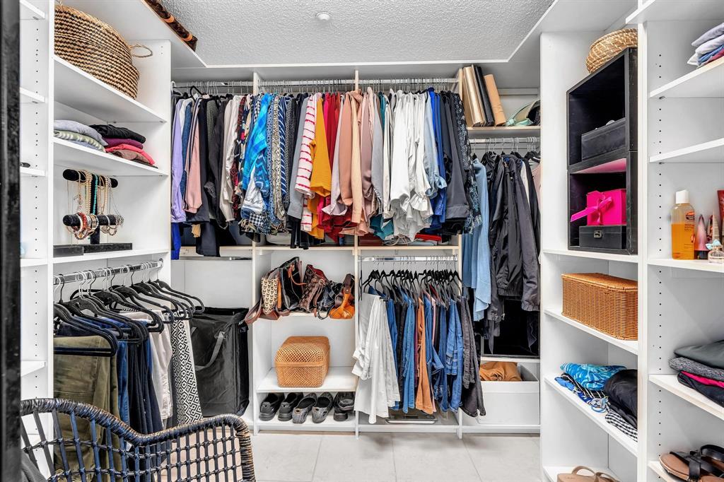 7775 Southampton Terrace, Unit 405 Tamarac, FL 33321 - Photo 36 of 82 a view of walk in closet with clothes and shoes
