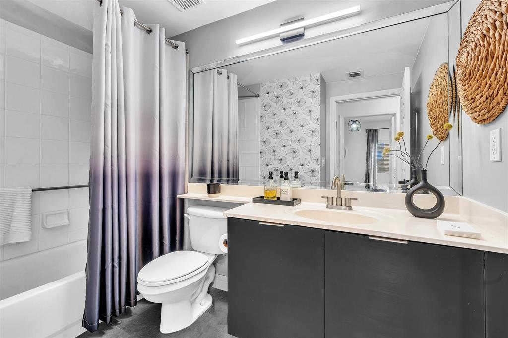 7775 Southampton Terrace, Unit 405 Tamarac, FL 33321 - Photo 41 of 82 a bathroom with a sink and a mirror