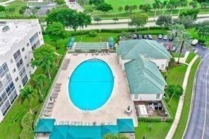 7775 Southampton Terrace, Unit 405 Tamarac, FL 33321 - Photo 53 of 82 an aerial view of a house with outdoor space and swimming pool