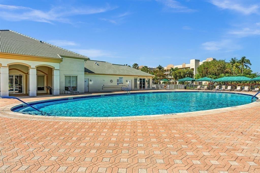 7775 Southampton Terrace, Unit 405 Tamarac, FL 33321 - Photo 54 of 82 a view of outdoor space yard and swimming pool
