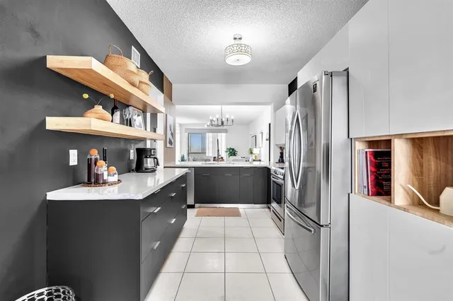 a view of a livingroom with furniture and a potted plant