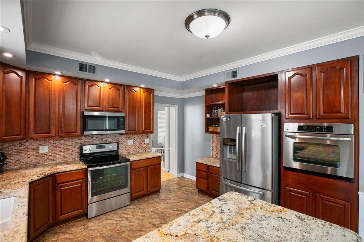 4724 Pole Road Alexandria, VA 22309 - Photo 14 of 54 Modern kitchen with rich wood accents.