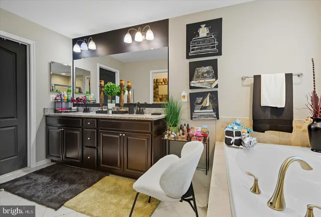 a kitchen with a refrigerator and cabinets