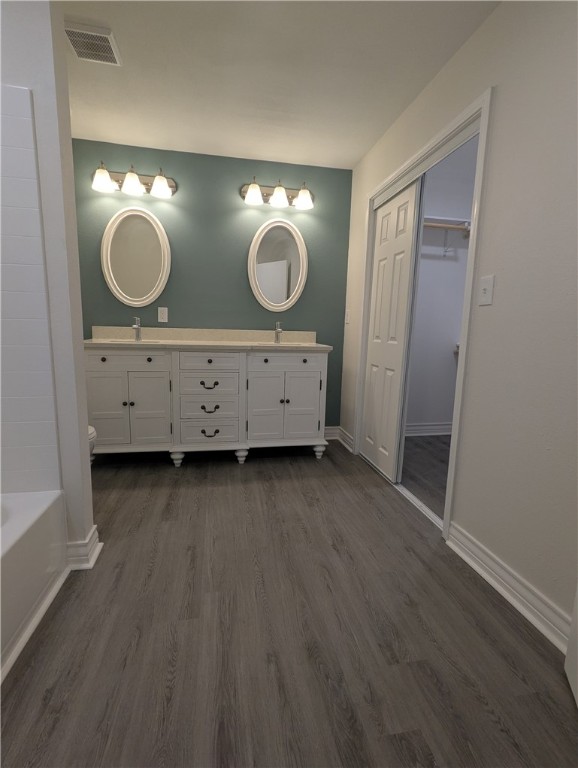 805 Anderson Street Corpus Christi, TX 78411 - Photo 14 of 15 a bathroom with a double vanity sink and mirror