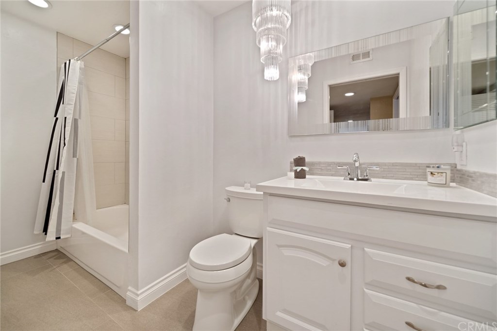 10 Windflower Aliso Viejo, CA 92656 - Photo 13 of 41 Completely Updated Main Level Bathroom with Shower/Tub Combo and Designer Chandelier Complimented with Recessed Lighting