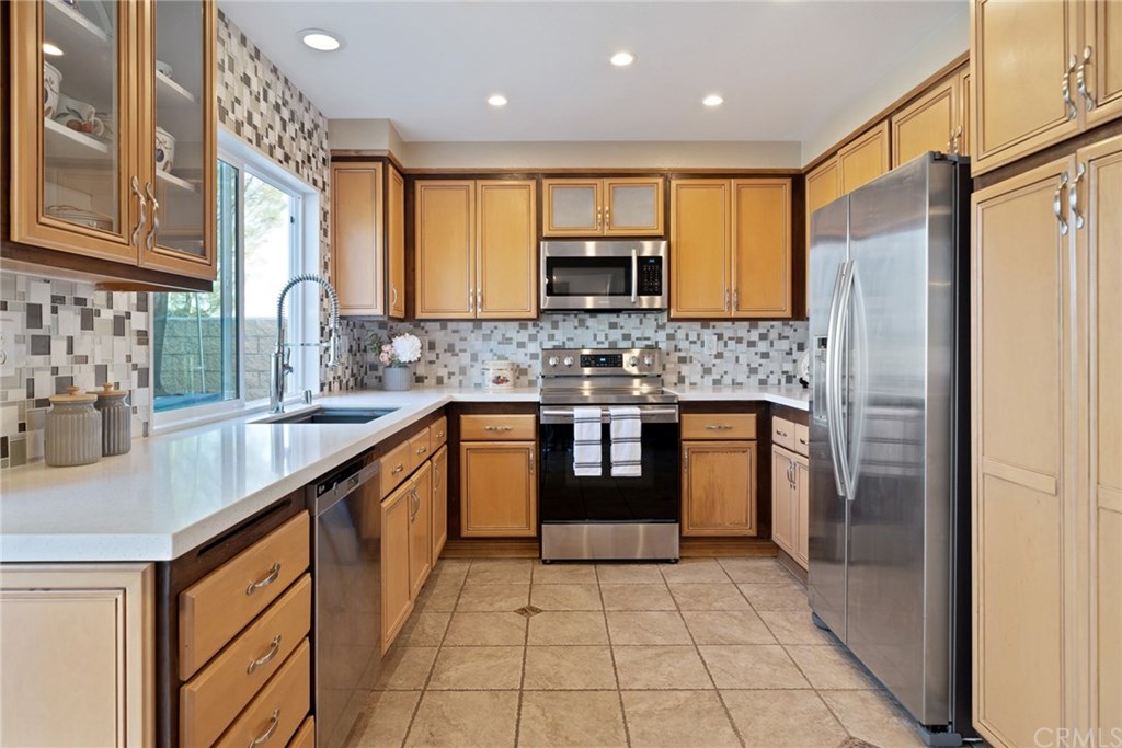 10 Windflower Aliso Viejo, CA 92656 - Photo 7 of 41 Updated Kitchen with Quartz Countertops, Designer Backsplash and Newer Stainless Steel Appliances