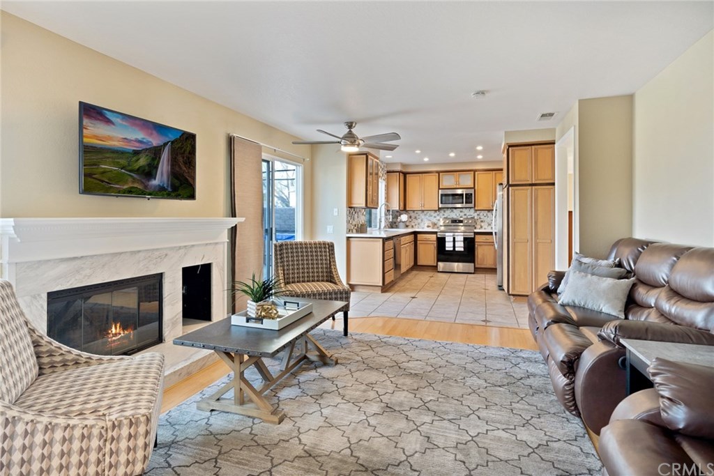 10 Windflower Aliso Viejo, CA 92656 - Photo 8 of 41 Kitchen Opens to Family Room with Large Hearth Fireplace and Slider Door to Backyard
