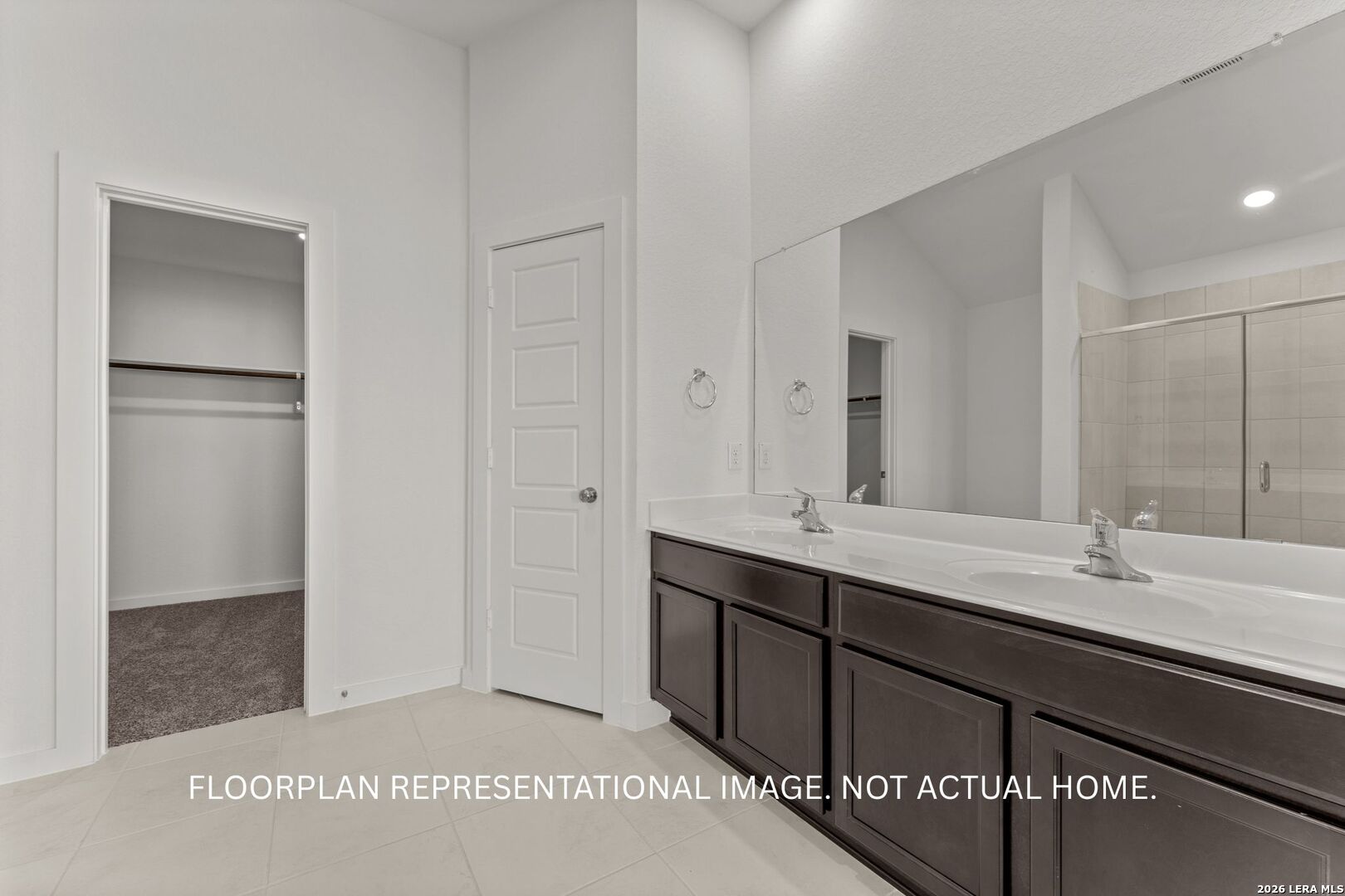 2914 Midlothian Way Converse, TX 78109 - Photo 12 of 16 a bathroom with a double vanity sink and mirror