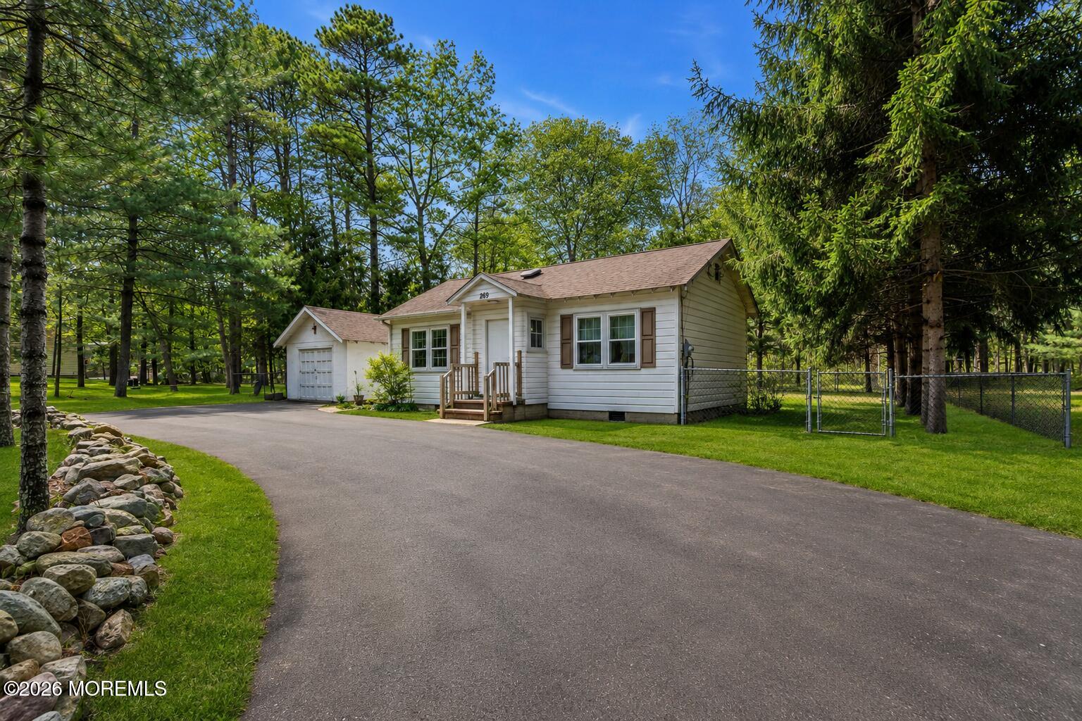 269 Alexander Avenue Howell, NJ 07731 - Photo 8 of 43 a view of an house with backyard and a tree
