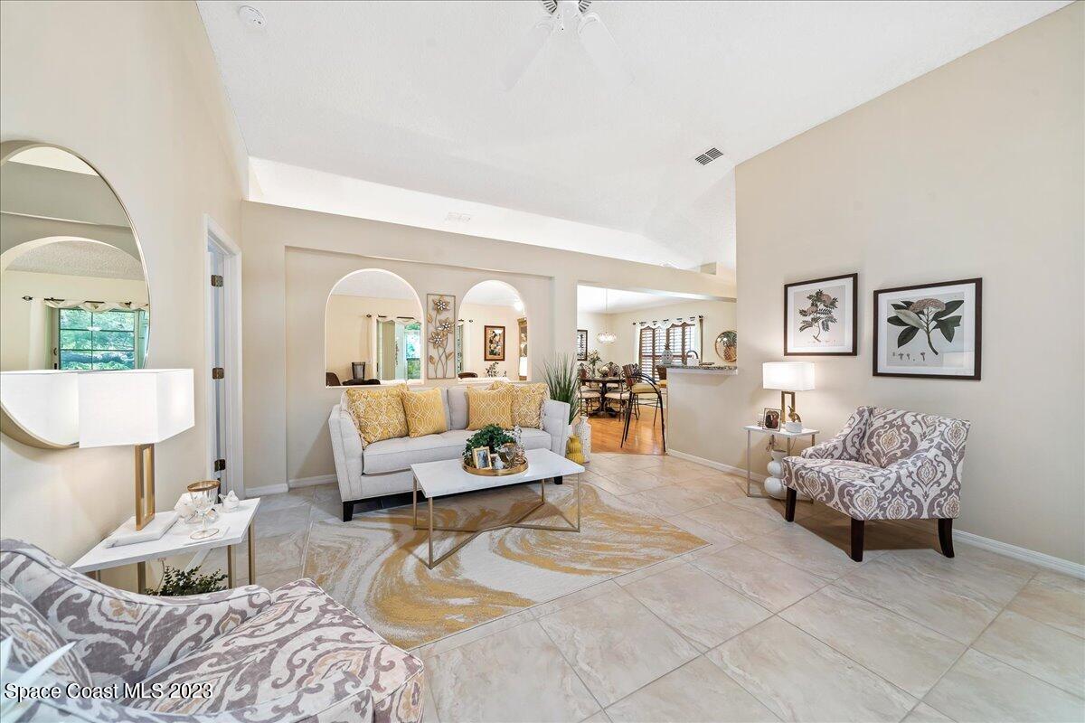 2190 Spring Creek Circle Palm Bay, FL 32905 - Photo 12 of 73 a bedroom with furniture and a large mirror