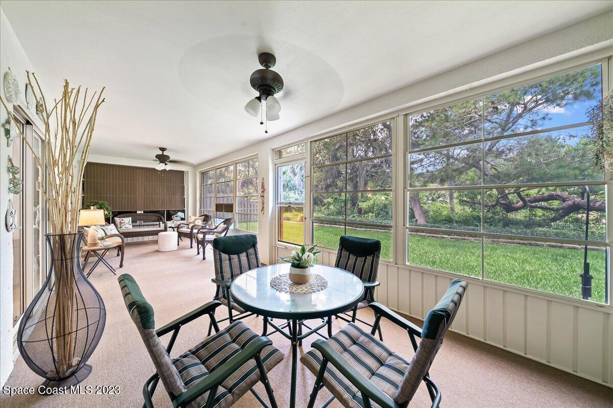 2190 Spring Creek Circle Palm Bay, FL 32905 - Photo 39 of 73 a view of a dining room with furniture window and outside view
